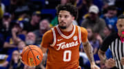 Feb 1, 2025; Baton Rouge, Louisiana, USA;  Texas Longhorns guard Jordan Pope (0) brings the ball up court against the LSU Tigers during the second half at Pete Maravich Assembly Center. Mandatory Credit: Stephen Lew-Imagn Images
