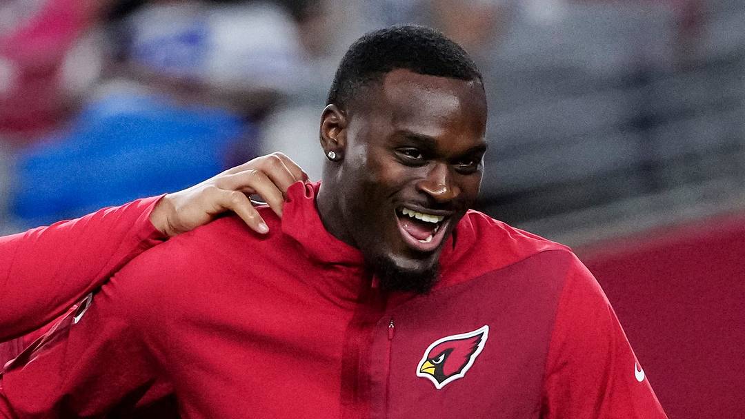 Arizona Cardinals running back Tyler Allgeier (center) jokes around with Jeremiyah Love (4) prior to a game at State Farm Stadium in Glendale on Aug. 22, 2026.
