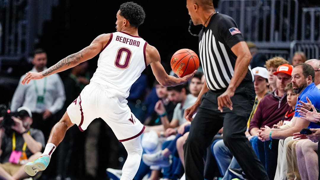 Jailen Bedford saving a ball from going out of bounds in the first round of the ACC Tournament against Wake Forest.