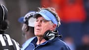 Oct 31, 2025; Syracuse, New York, USA; North Carolina Tar Heels head coach Bill Belichick prepares to call a timeout in the second quarter against the Syracuse Orange at the JMA Wireless Dome. 