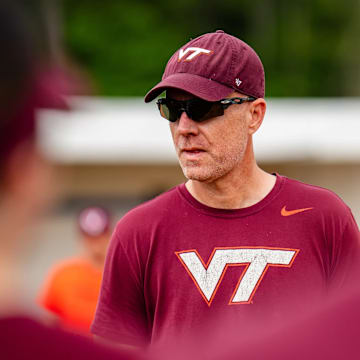Virginia Tech head coach Pete D'Amour watches over practice.