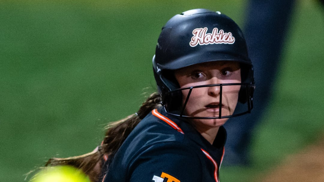 Catcher Zoe Yaeger eyes the softball down on the base paths.