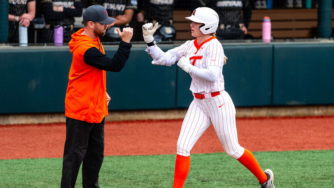 Emma Mazzarone rounds third to a fist bump after hitting a solo homerun against Bryant. (3/8/26)