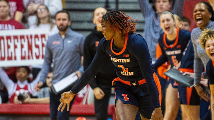 Illinois' Jasmine Brown-Hagger (8) shows three fingers as the Illinois' bench celebrates her three-pointer during the Indiana versus Illinois women's basketball game at Simon Skjodt Assembly Hall on Thursday, Jan. 16, 2025.