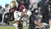 Nov 1, 2025; Tallahassee, Florida, USA; Wake Forest Demon Deacons quarterback Robby Ashford (2) is tackled by Florida State Seminoles defensive back Shyheim Brown (1) during the second half at Doak S. Campbell Stadium. Mandatory Credit: Melina Myers-Imagn Images