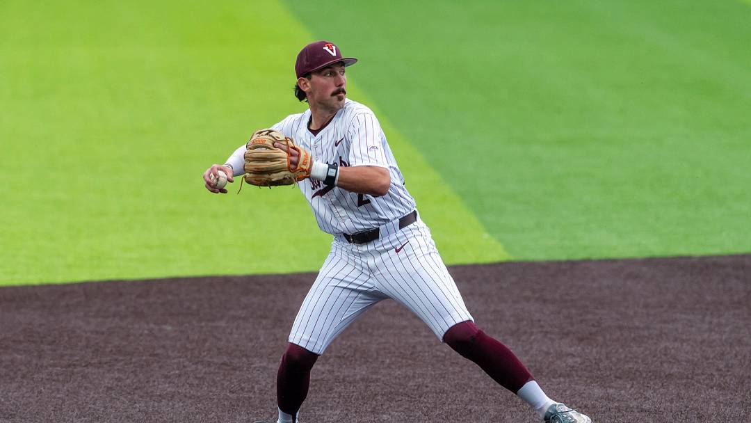 Blacksburg, VA — Owen Petrich loads to throw to first base against Clemson in game 1, 2026.