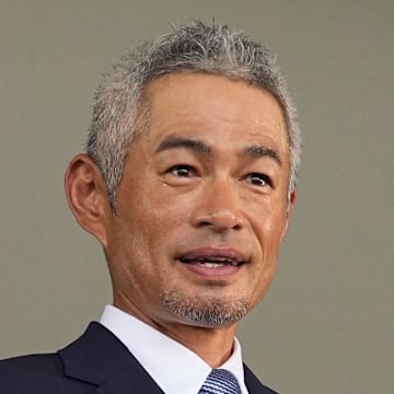 Ichiro Suzuki poses with his plaque after being inducted into the National Baseball Hall of Fame on July 27 in Cooperstown, N.Y.