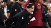 Aug 8, 2025; Foxborough, Massachusetts, USA; Washington Commanders head coach Dan Quinn reacts during the first half against the New England Patriots at Gillette Stadium. Mandatory Credit: Paul Rutherford-Imagn Images