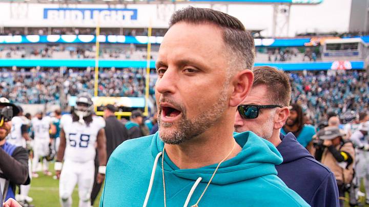 Tennessee Titans quarterback Cam Ward (1) talks with Jacksonville Jaguars defensive coordinator Anthony Campanile after the game at EverBank Stadium, Sunday, Jan. 4, 2026, in Jacksonville, Fla. The Jaguars defeated the Titans 41-7 