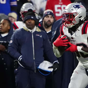 Dec 22, 2024; Orchard Park, New York, USA; New England Patriots running back Rhamondre Stevenson (38) runs with the ball after making a catch against the Buffalo Bills during the first half at Highmark Stadium. Mandatory Credit: Gregory Fisher-Imagn Images
