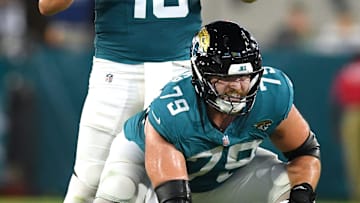 Jacksonville Jaguars quarterback Mac Jones (10) gives instructions to the offensive line while lined up behind center Luke Fortner (79) during early second quarter action. The Jacksonville Jaguars hosted the Tampa Bay Buccaneers at EverBank Stadium for the Jaguars second preseason game of the season Saturday, August 17, 2024.