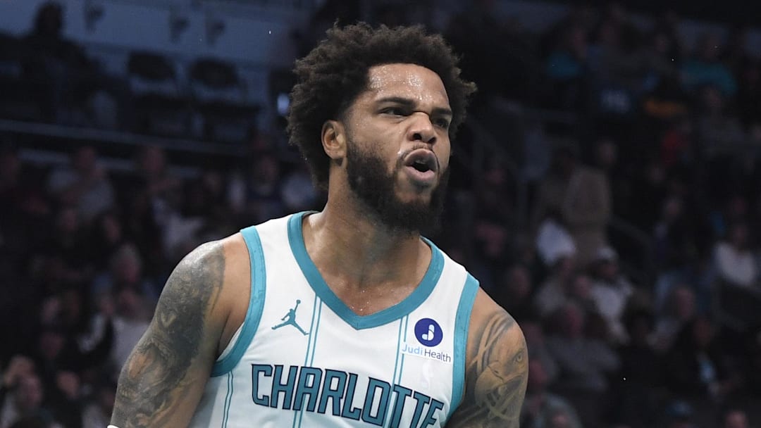 Dec 7, 2025; Charlotte, North Carolina, USA; Charlotte Hornets forward Miles Bridges (0) reacts after scoring during the first half against the Denver Nuggets at the Spectrum Center. Mandatory Credit: Sam Sharpe-Imagn Images