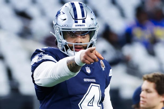 Dallas Cowboys quarterback Dak Prescott points before the game against the Los Angeles Rams at AT&T Stadium 