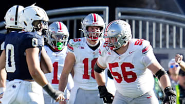 Ohio State Buckeyes quarterback Will Howard (18)tries to call a play behind offensive lineman Seth McLaughlin (56) during the NCAA football game against the Penn State Nittany Lions at Beaver Stadium in University Park, Pa. on Monday, Nov. 4, 2024. Ohio State won 20-13.