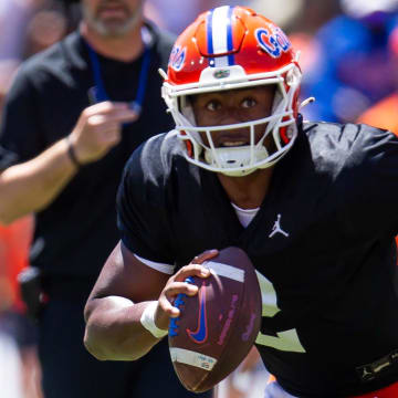 Florida Gators quarterback DJ Lagway (2) rolls out of the pockete in the first half during the Orange and Blue game at Ben Hill Griffin Stadium in Gainesville, FL on Saturday, April 13, 2024