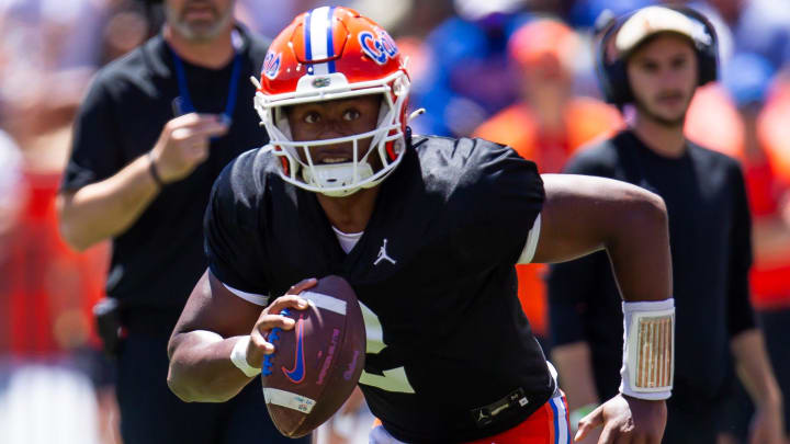 Florida Gators quarterback DJ Lagway (2) rolls out of the pockete in the first half during the Orange and Blue game at Ben Hill Griffin Stadium in Gainesville, FL on Saturday, April 13, 2024