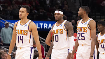 Mar 16, 2022; Houston, Texas, USA; Phoenix Suns guard Landry Shamet (14) forward Torrey Craig (0) and forward Mikal Bridges (25) and guard Aaron Holiday (4) and center JaVale McGee (00) come out to play against the Houston Rockets in the fourth quarter at Toyota Center. Mandatory Credit: Thomas B. Shea-Imagn Images