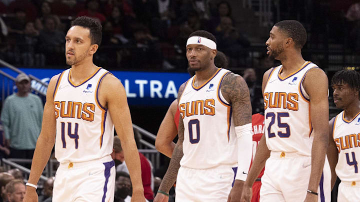 Mar 16, 2022; Houston, Texas, USA; Phoenix Suns guard Landry Shamet (14) forward Torrey Craig (0) and forward Mikal Bridges (25) and guard Aaron Holiday (4) and center JaVale McGee (00) come out to play against the Houston Rockets in the fourth quarter at Toyota Center. Mandatory Credit: Thomas B. Shea-Imagn Images