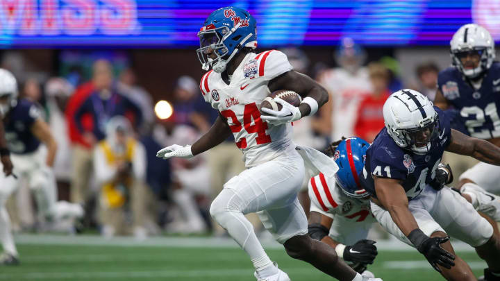 Dec 30, 2023; Atlanta, GA, USA; Mississippi Rebels running back Ulysses Bentley IV (24) runs the ball against the Penn State Nittany Lions in the second quarter at Mercedes-Benz Stadium. Mandatory Credit: Brett Davis-USA TODAY Sports