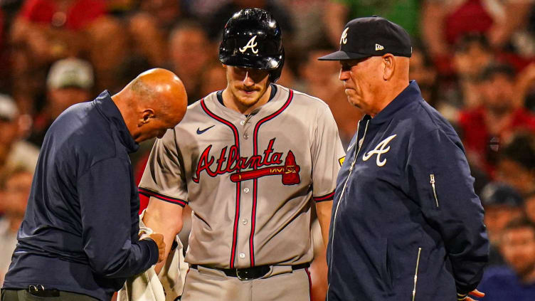 Jun 4, 2024; Boston, Massachusetts, USA; Atlanta Braves catcher Sean Murphy (12) is looked at with Atlanta Braves manager Brian Snitker (43) by his side after being hit by a pitch in the right arm against the Boston Red Sox in the ninth inning at Fenway Park. Mandatory Credit: David Butler II-USA TODAY Sports