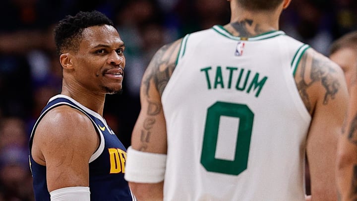 Jan 7, 2025; Denver, Colorado, USA; Denver Nuggets guard Russell Westbrook (4) talks to Boston Celtics forward Jayson Tatum (0) after a play in the third quarter at Ball Arena. Mandatory Credit: Isaiah J. Downing-Imagn Images Jan 7, 2025; Denver, Colorado, USA; Denver Nuggets guard Russell Westbrook (4) talks to Boston Celtics forward Jayson Tatum (0) after a play in the third quarter at Ball Arena. Mandatory Credit: Isaiah J. Downing-Imagn Images