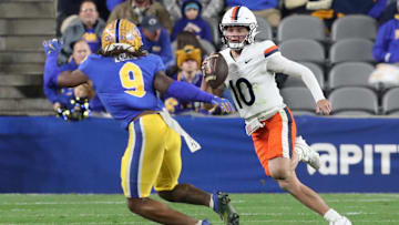 Nov 9, 2024; Pittsburgh, Pennsylvania, USA;  Virginia Cavaliers quarterback Anthony Colandrea (10) runs the ball against Pittsburgh Panthers linebacker Kyle Louis (9) during the third quarter at Acrisure Stadium. Mandatory Credit: Charles LeClaire-Imagn Images