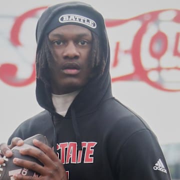 Oct 25, 2025; Pittsburgh, Pennsylvania, USA; North Carolina State Wolfpack quarterback CJ Bailey (11) warms up before the game against the Pittsburgh Panthers at Acrisure Stadium. Mandatory Credit: Charles LeClaire-Imagn Images
