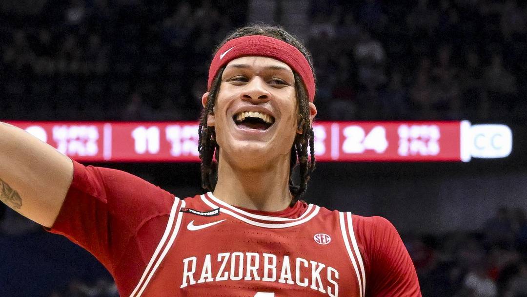 Mar 13, 2025; Nashville, TN, USA;  Arkansas Razorbacks forward Trevon Brazile (4) reacts after a made three point basket  against the Mississippi Rebels during the second half at Bridgestone Arena. Mandatory Credit: Steve Roberts-Imagn Images
