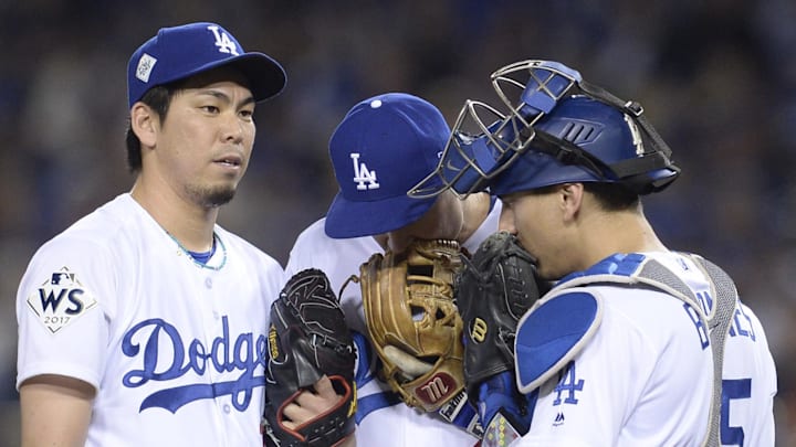 Dodgers pitcher Kenta Maeda (left) talks with catcher Austin Barnes (15) and infielder Chase Utley (26) in the 7th inning against the Houston Astros in game six of the 2017 World Series at Dodger Stadium. Dodgers pitcher Kenta Maeda (left) talks with catcher Austin Barnes (15) and infielder Chase Utley (26) in the 7th inning against the Houston Astros in game six of the 2017 World Series at Dodger Stadium.