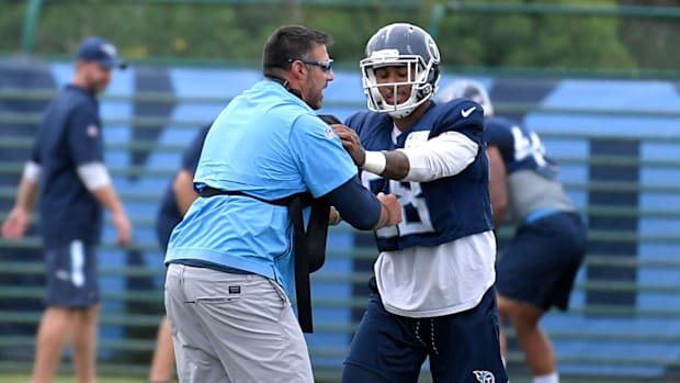Titans coach Mike Vrabel practices with Harold Landry (#58) at Saint Thomas Sports Park on Wednesday, Sept. 5, 2018.