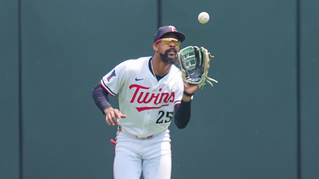 Jul 12, 2025; Minneapolis, Minnesota, USA; Minnesota Twins outfielder Byron Buxton (25) fields a fly ball against the Pittsburgh Pirates in the first inning at Target Field. Mandatory Credit: Brad Rempel-Imagn Images