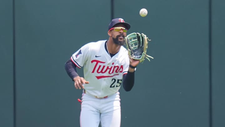 Jul 12, 2025; Minneapolis, Minnesota, USA; Minnesota Twins outfielder Byron Buxton (25) fields a fly ball against the Pittsburgh Pirates in the first inning at Target Field. Mandatory Credit: Brad Rempel-Imagn Images