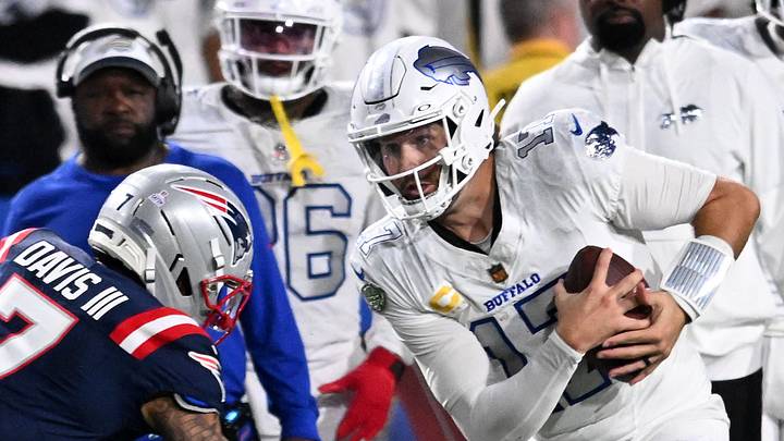 Oct 5, 2025; Orchard Park, New York, USA; Buffalo Bills quarterback Josh Allen (17) rushes the ball against New England Patriots cornerback Carlton Davis III (7) during the second half at Highmark Stadium. Mandatory Credit: Mark Konezny-Imagn Images