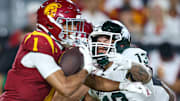 Michigan State EDGE Isaac Smith goes for a tackle during the Spartans' game against USC on Sept. 20, 2025.