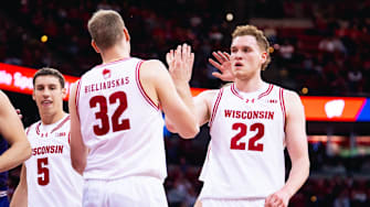 Austin Rapp (22) celebrated Aleksas Bieliauskas (32) basket and getting fouled in the first half. Wisconsin beat Northwestern, 85-73, to open Big Ten play on December 3, 2025.