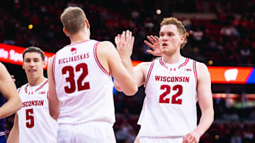 Austin Rapp (22) celebrated Aleksas Bieliauskas (32) basket and getting fouled in the first half. Wisconsin beat Northwestern, 85-73, to open Big Ten play on December 3, 2025.