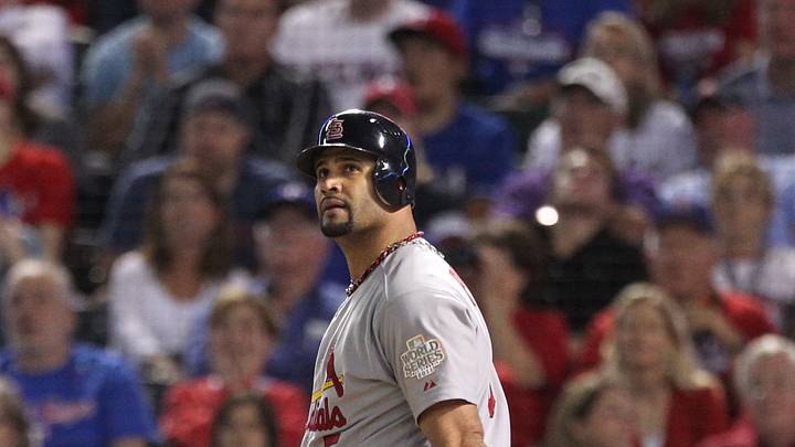 Oct 22, 2011; Arlington, TX, USA; St. Louis Cardinals first baseman Albert Pujols hits a three-run home run in the sixth inning of game three of the 2011 World Series against the Texas Rangers at Rangers Ballpark. Mandatory Credit: Matthew Emmons-USA TODAY Sports