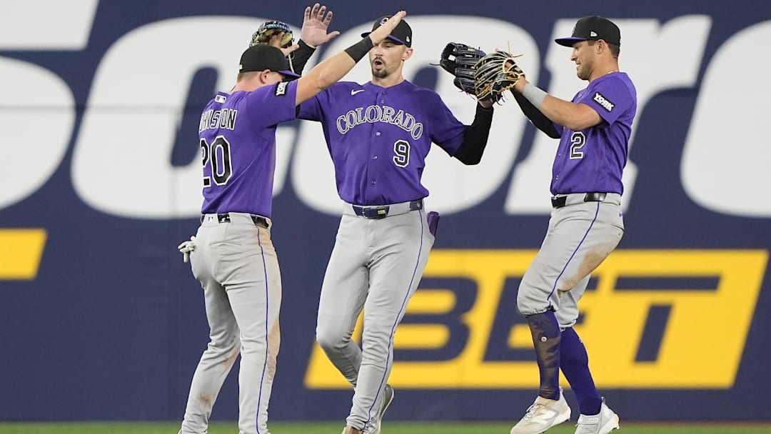 Apr 1, 2026: Colorado Rockies left fielder Troy Johnston (20) and center fielder Brenton Doyle (9) and right fielder Tyler Freeman (2) celebrate a win over the Toronto Blue Jays after the tenth inning at Rogers Centre. Apr 1, 2026: Colorado Rockies left fielder Troy Johnston (20) and center fielder Brenton Doyle (9) and right fielder Tyler Freeman (2) celebrate a win over the Toronto Blue Jays after the tenth inning at Rogers Centre.