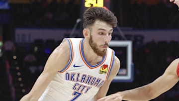 Oct 9, 2024; Oklahoma City, Oklahoma, USA; Oklahoma City Thunder forward Chet Holmgren (7) drives around Houston Rockets guard Reed Sheppard (15) during the second quarter at Paycom Center. Mandatory Credit: Alonzo Adams-Imagn Images