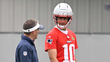 Jun 9, 2025; Foxborough, MA, USA; New England Patriots offensive coordinator Josh McDaniels works with quarterback Drake Maye (10) during minicamp at Gillette Stadium. Mandatory Credit: Eric Canha-Imagn Images