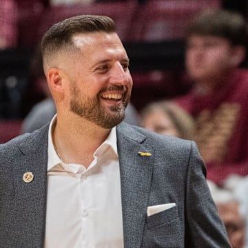 Florida State Seminoles head coach Luke Loucks smiles as his players celebrate. The Florida State Seminoles defeated the Alcorn State Braves 108-76 on Tuesday, Nov. 4, 2025.
