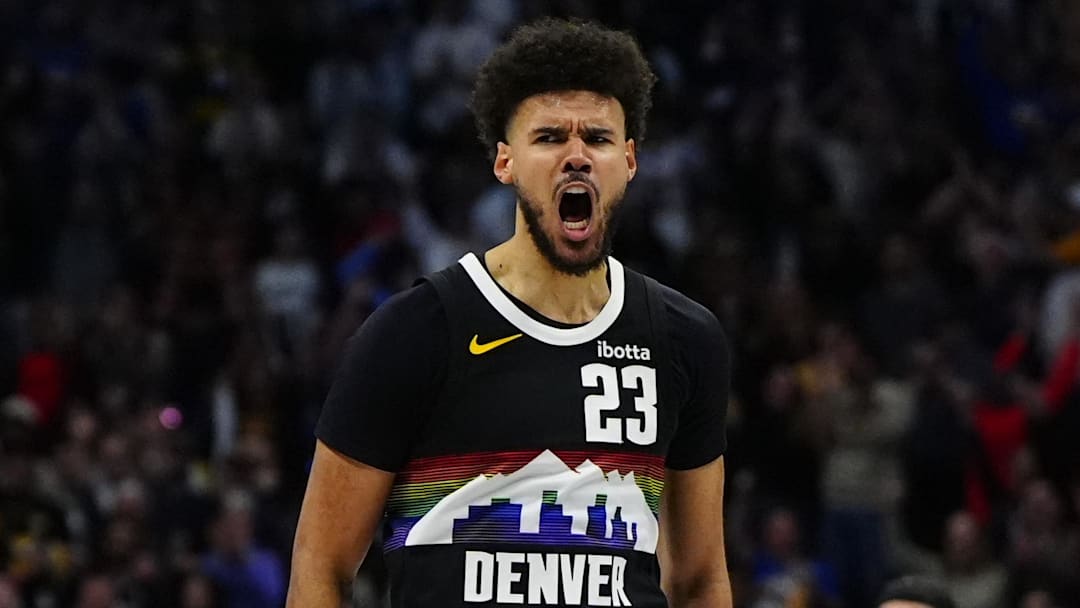 Apr 4, 2026; Denver, Colorado, USA; Denver Nuggets forward Cameron Johnson (23) reacts to his three point score in overtime against the San Antonio Spurs at Ball Arena. Mandatory Credit: Ron Chenoy-Imagn Images