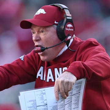 Arkansas Razorbacks interim coach Bobby Petrino argues with an official during the third quarter against the Mississippi State Bulldogs at Donald W. Reynolds Razorback Stadium during the Hogs' homecoming game Saturday.