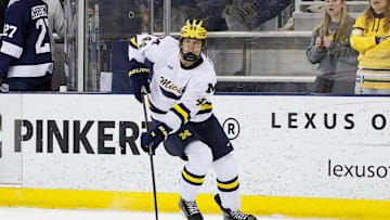March 8, 2025; Ann Arbor, Michigan, USA; Michigan Wolverines forward Will Horcoff (44) handles the puck during the first period against the Penn State Nittany Lions at Yost Ice Arena. Mandatory Credit: Brian Bradshaw Sevald-Imagn Images