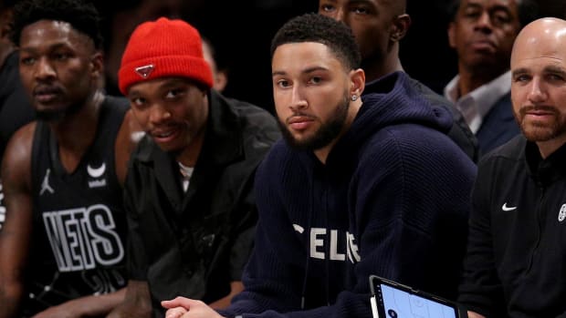 Dec 22, 2023; Brooklyn, New York, USA; Brooklyn Nets injured guard Ben Simmons (10) watches from the bench during the second quarter against the Denver Nuggets at Barclays Center. Mandatory Credit: Brad Penner-USA TODAY Sports
