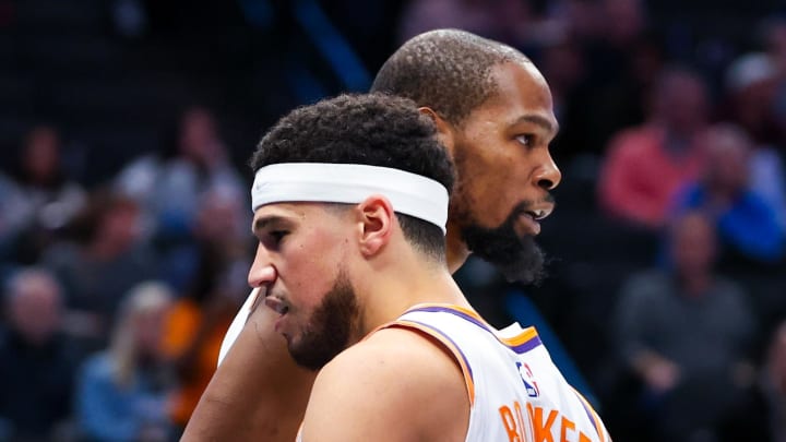 Jan 24, 2024; Dallas, Texas, USA;  Phoenix Suns forward Kevin Durant (35) celebrates with Phoenix Suns guard Devin Booker (1) during the third quarter against the Dallas Mavericks at American Airlines Center. Mandatory Credit: Kevin Jairaj-USA TODAY Sports