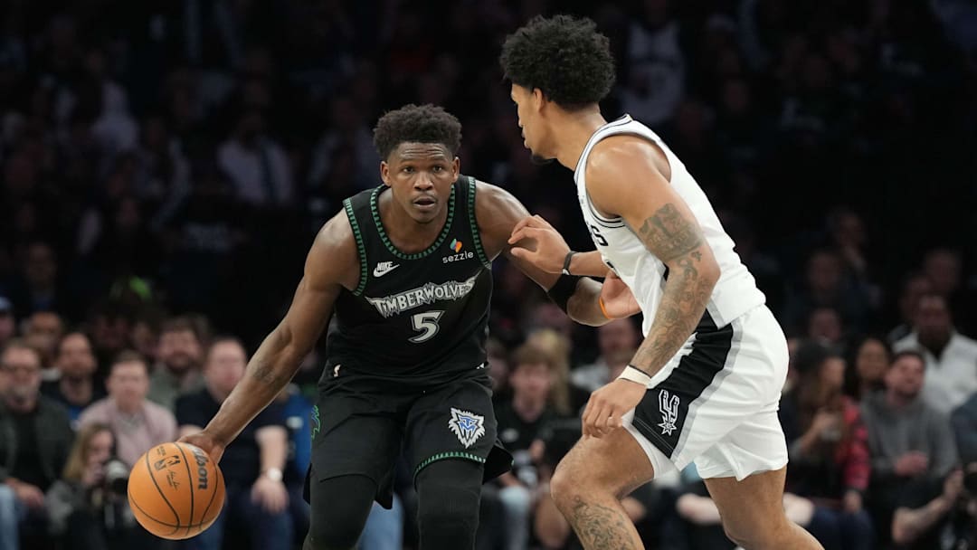 May 8, 2026; Minneapolis, Minnesota, USA; Minnesota Timberwolves guard Anthony Edwards (5) dribbles against the San Antonio Spurs guard Dylan Harper (2) in the second half during Game 3 of the second round of the 2026 NBA Playoffs at Target Center.