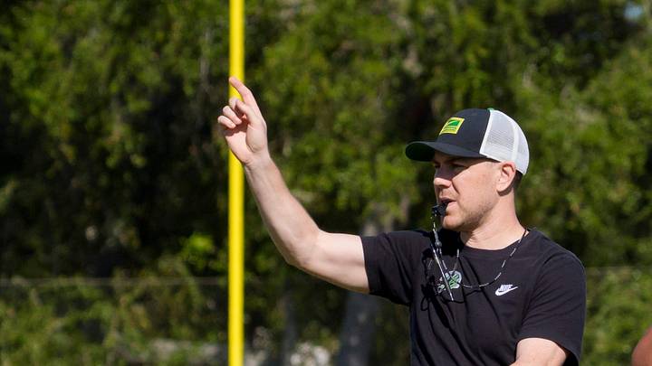 Oregon offensive coordinator Will Stein walks the field as the Oregon Ducks practice at Barry University ahead of the Orange Bowl on Dec. 30, 2025, in Miami, Florida.