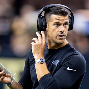 Sep 8, 2024; New Orleans, Louisiana, USA;  Carolina Panthers head coach Dave Canales talks to down judge Derick Bowers (74) on a time out against the New Orleans Saints during the first half at Caesars Superdome. 