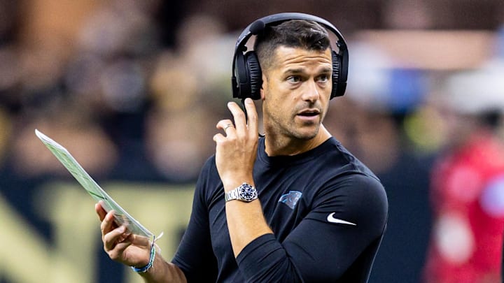 Sep 8, 2024; New Orleans, Louisiana, USA;  Carolina Panthers head coach Dave Canales talks to down judge Derick Bowers (74) on a time out against the New Orleans Saints during the first half at Caesars Superdome. 